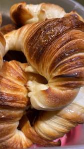 a pile of pastries sitting on top of a plate at Las Marianas Hotel in San Carlos de Bariloche