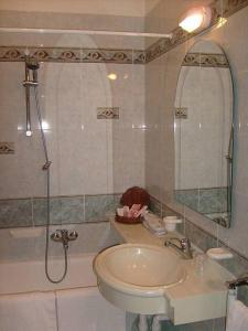 a bathroom with a sink and a shower and a toilet at Hotel Motel Flower in Novi Ligure +22 photos