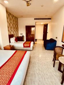 Postel nebo postele na pokoji v ubytování Amora Rooms Dwarka