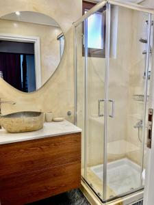 a bathroom with a sink and a shower at Erietta Suites in Chania Town