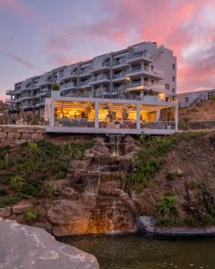 a building on a bridge over a body of water at Hacienda el Sueno in Fuengirola
