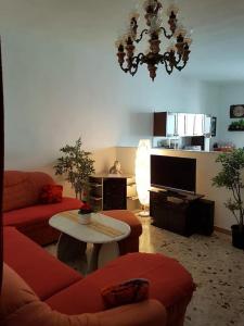 a living room with a couch and a table at Salento - Casa vacanza di Diana Carcagni in Nardò