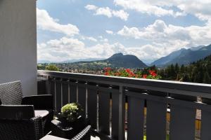 a balcony with a view of the mountains at Wildgrün Maxi Lodge 12 in Pfronten