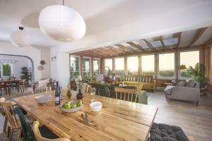 a living room with a wooden table and chairs at Westaway House in Port Isaac
