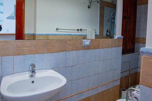 a bathroom with a sink and a mirror at Affitti Brevi Toscana - Ospitalità a P. S. Stefano in Porto Santo Stefano