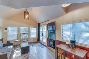 a living room with a couch and a table at Quiet Lake Almanor Cabin, Steps to Fishing in Lake Almanor