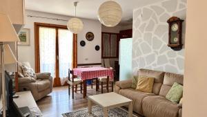 a living room with a couch and a table at M324 - Marcelli, delizioso trilocale con terrazzo panoramico in Marcelli