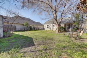 a house with a yard with a table and a tree at Quiet Fort Worth Home Less Than 1 Mi to TCU Campus! in Fort Worth