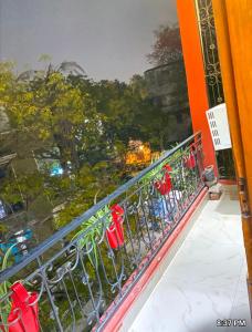 a balcony with a bunch of chairs on it at The Super Residency in New Delhi