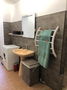 a bathroom with a sink and a mirror at La terrasse des capucines in Sète +12 photos