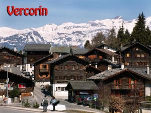 a group of people walking in front of a mountain at La Montagnette, VERCORIN in Vercorin