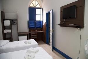 Un pat sau paturi într-o cameră la Hotel Providencia