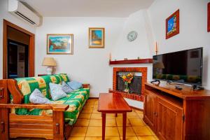 TV a/nebo společenská místnost v ubytování Affitti Brevi Toscana - Ospitalità a Porto Ercole