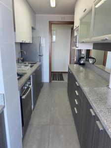 Cucina o angolo cottura di Departamentos Mednav Montemar & Spa