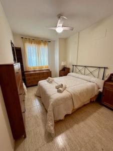 Apartamento Mar de Oropesa I Ref 003 tesisinde bir odada yatak veya yataklar