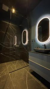 a bathroom with a sink and a mirror at New Luxury Apartment Vienna in Vienna