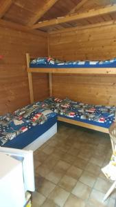 a bedroom with two bunk beds in a cabin at Panelovka in Bítov