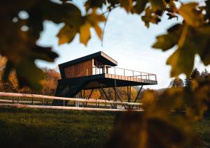 a building in the middle of a field at Treedom in Prievidza