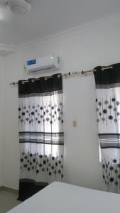 a pair of curtains in a room at Bamboo House BnB in Bondeni