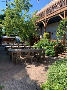 a group of tables and chairs in front of a building at The Northport Inn Boutique Hotel R202 in Northport