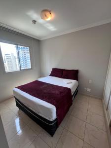 En eller flere senge i et værelse på Apartamento Paulista