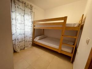Postel nebo postele na pokoji v ubytování Apartamentos Los Almendros 3000