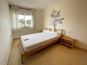 Postel nebo postele na pokoji v ubytování Apartamentos Los Almendros 3000