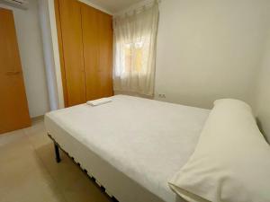 Postel nebo postele na pokoji v ubytování Apartamentos Los Almendros 3000