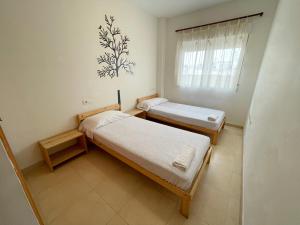Postel nebo postele na pokoji v ubytování Apartamentos Los Almendros 3000