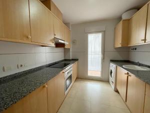 Kuchyň nebo kuchyňský kout v ubytování Apartamentos Los Almendros 3000