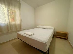 Postel nebo postele na pokoji v ubytování Apartamentos Los Almendros 3000