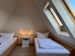 Ein Bett oder Betten in einem Zimmer der Unterkunft Haus am Südende Nordsee