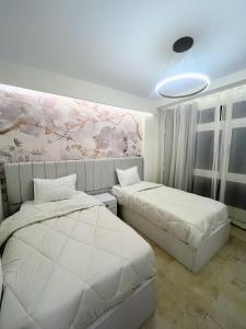 Ένα ή περισσότερα κρεβάτια σε δωμάτιο στο Property sisters, Elite apartment, Madinaty B12