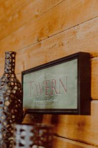 a sign that saysavan next to a bottle on a table at Private Cabin-Shuttle Pass Included! in Thompsonville +34 photos