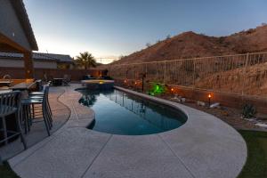 a swimming pool in the middle of a yard at Heated Pool at Double Eagle BL991277 by J and Amy in Mesquite