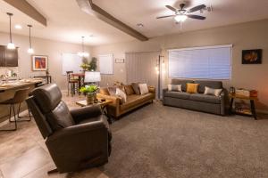 a living room with two couches and a table at Heated Pool at Double Eagle BL991277 by J and Amy in Mesquite