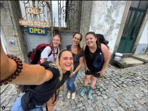 a group of women posing for a picture on a street at Casa dos Caminhos de Santiago in Mosteiró