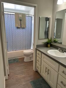 a bathroom with a toilet and a sink at Hollywood two bedroom apartments close to Studios Universal in Los Angeles