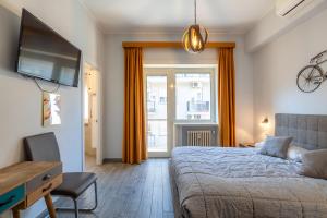 Postel nebo postele na pokoji v ubytování RomAntica Vatican Suites