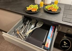 a drawer with two plates of food and fruit at Bee Stays - Afton House in Cronton