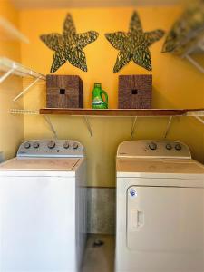 a kitchen with a stove and some stars on the wall at 6 D, One Bedroom Condo in Destin