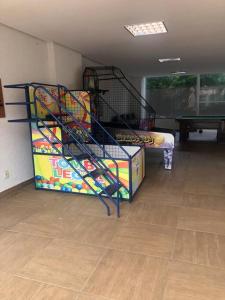 a room with a bunk bed and a stair case at Flat Vereda, 524 -Rio quente. in Rio Quente +21 photos