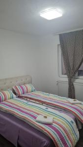 Een bed of bedden in een kamer bij BIANCA LuX