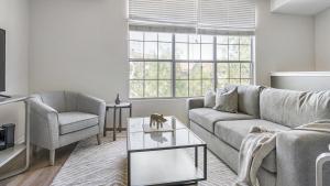 a living room with a couch and a chair at Landing Modern Apartment with Amazing Amenities (ID1167X009) in El Paso