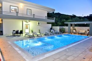 a swimming pool in the backyard of a house at Villa with private pool Zambakas in Kalithies
