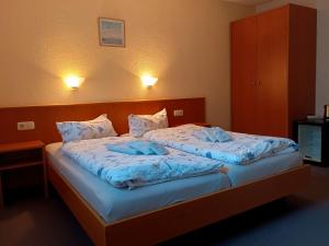 Postel nebo postele na pokoji v ubytování Pension Stocker + 12 fotografií