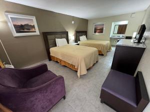 Postel nebo postele na pokoji v ubytování River Palm Hotel
