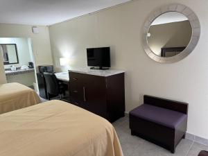 TV a/nebo společenská místnost v ubytování River Palm Hotel