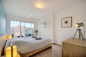 Ένα ή περισσότερα κρεβάτια σε δωμάτιο στο Mary - Terrasse - Moderne - VCA