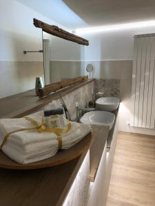 a bathroom with a sink and a bath tub at Villa Fontana in Celle Ligure